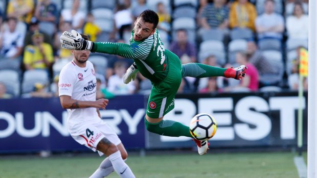 Beaten: Wanderers goalkeeper Vedran Janjetovic can't stop Petros Skapetis's header for the Mariners to draw the game back to 2-1.