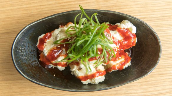 Cauliflower with sweet, dark chilli sauce is like vego Korean fried chicken.