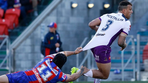 Elusive: Sione Mata'Utia can't hang on to William Chambers.