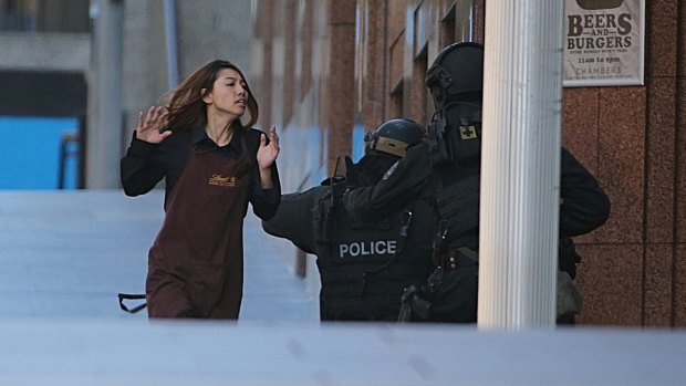 A Lindt cafe worker flees to safety during dramatic scenes in Sydney