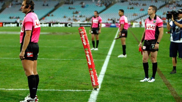 In the pink: The NRL is set to give the extra sideline officials another go.