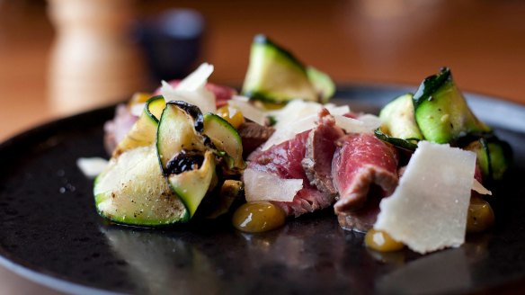 Beef carpaccio with zucchini ribbons and parmesan.