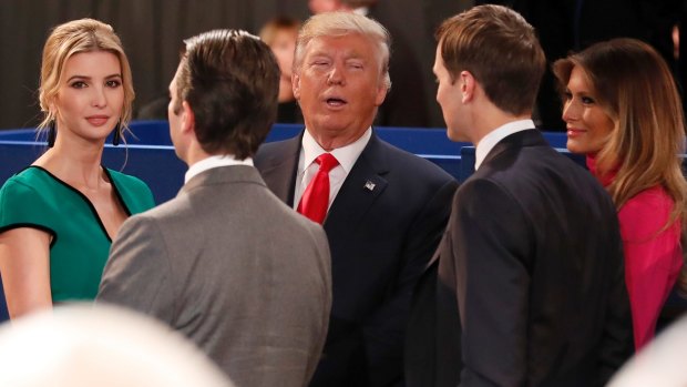 Donald Trump, centre, talks to his daughter Ivanka, left, Donald Jr, Ivanka's husband Jared Kushner and his wife Melania Trump after the second presidential debate.