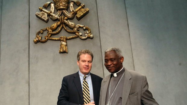 Vatican spokesman Greg Burke with Cardinal Peter Turkson, who is the only Vatican official scheduled to speak in the meeting of business leaders and NGOs.