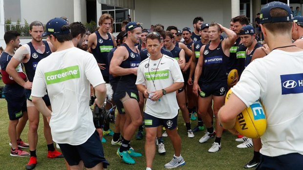 Carlton coach Brendon Bolton addresses his players during a training session.