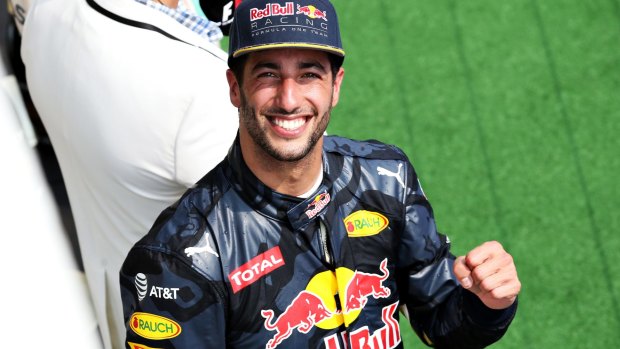 Daniel Ricciardo celebrates his third position on the podium at the Hungarian Grand Prix.