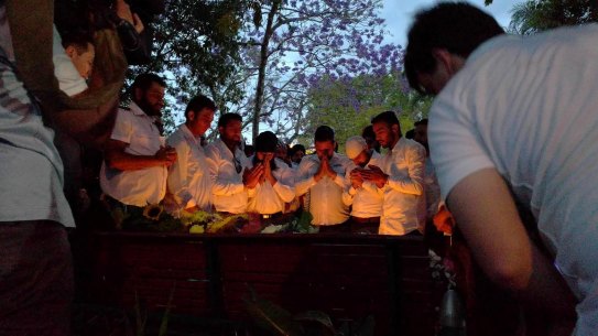Members of the community mourn their colleague killed when an 'incendiary device' was allegedly thrown onto a bus in Moorooka.