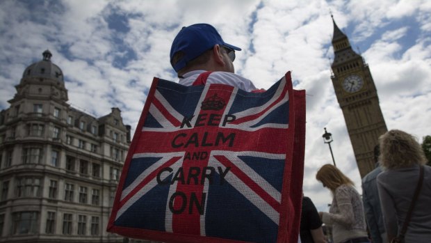 A tourist  near the Houses of Parliament after the Brexit vote. 