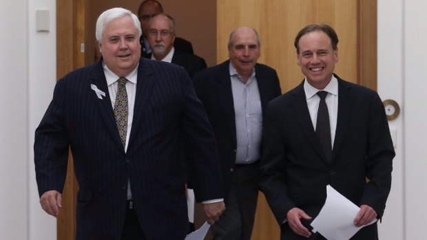 PUP leader Clive Palmer and Environment Minister Greg Hunt, followed by Climate Change Authority boss Bernie Fraser. 