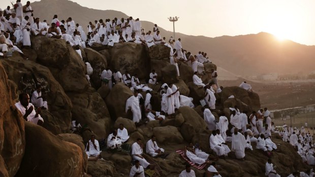 Muslim pilgrims pray on the Mountain of Mercy during Haj. Mount Arafat, marked by a white pillar, is where Prophet Muhammad is believed to have delivered his last sermon to tens of thousands of followers some 1,400 years ago, calling on Muslims to unite.
