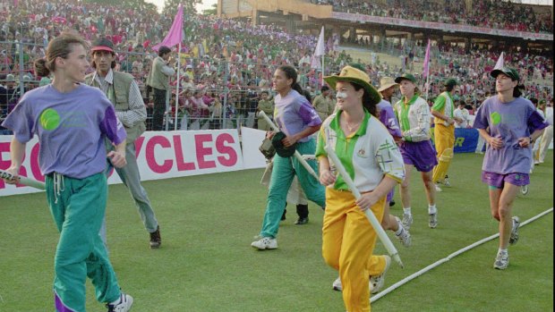 Belinda Clark and the Australian team celebrate their World Cup triumph in front of 83,000 fans at Eden Gardens in Kolkata in 1997.