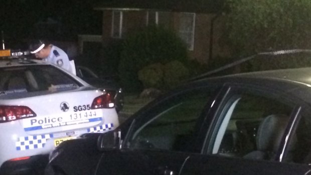 Police in front of the Bexley home where a woman was stabbed to death and her daughter was injured.