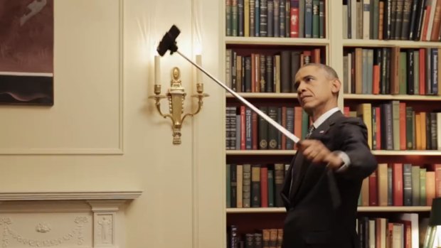 US President Barack Obama captures himself on a selfie stick in this still from the video.