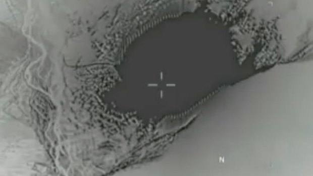A Still image from video released by the US Department of Defence shows the GBU-43 bomb strike.