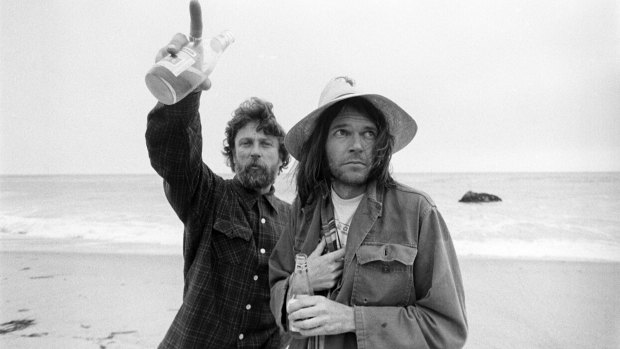 Gary Burden, left, with Neil Young on the beach at Malibu, California, in 1975. 