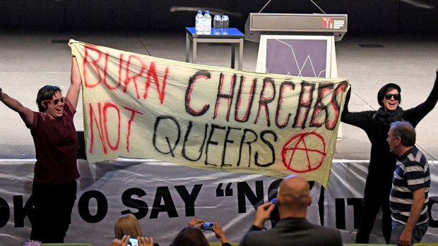 Protesters unfurled a sign at the Coalition for Marriage event.