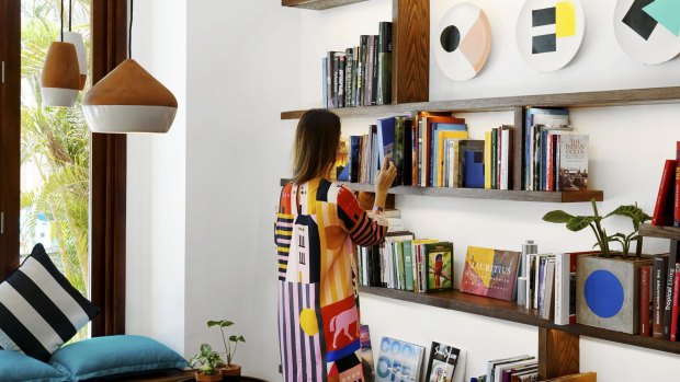 The entry foyer features a library nook with more than 200 books.