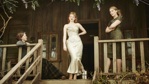 Sarah Snook (centre) alongside co-stars Judy Davis and Kate Winslet after her character's "classic ugly duckling to swan" transformation in The Dressmaker.