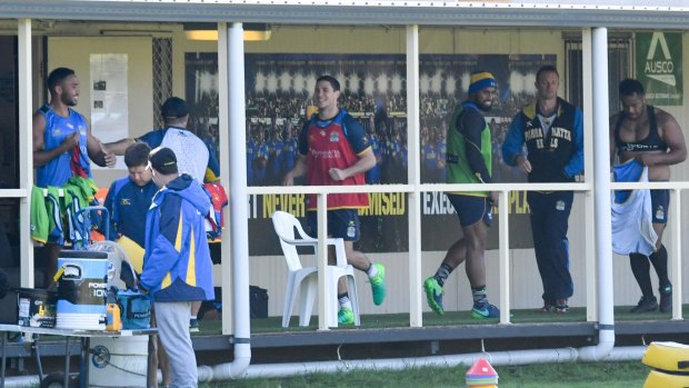 Making himself at home: Mitchell Moses (red top) prepares to train with the Eels for the first time.
