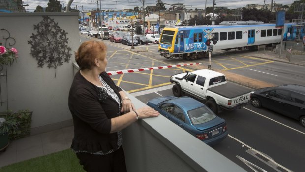 Mella Gigis bought next to the rail line in Preston in 2013 and says she has slowly been driven mad by car and train noise. 