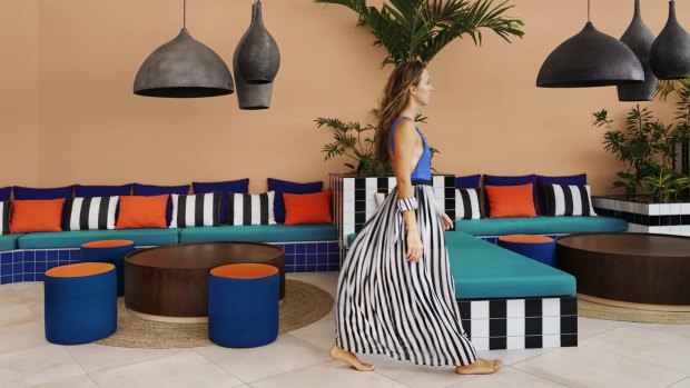 Bright tropical hues and thick black-and-white stripes appear throughout the resort. 