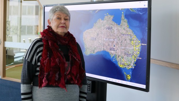 Historian Professor Lyndall Ryan in front of the map mapping Aboriginal massacres.