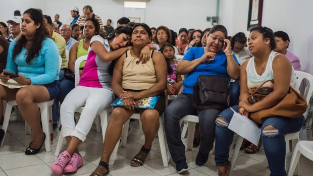 The relatives of missing people gather to give DNA samples at a church in Veracruz City, Mexico, in March.
