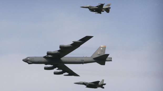 A US Air Force B-52 bomber flies over Osan Air Base in Pyeongtaek, South Korea.