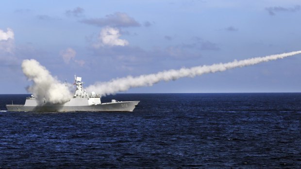  A Chinese frigate launches an anti-ship missile during military exercises in the South China Sea. Country's strategy is aimed partly at keeping the US at bay. 