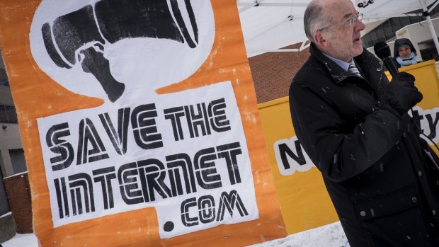 Michael Copps, ex-commissioner of the FCC, speaks in favour of net neutrality during a demonstration outside of FCC headquarters in Washington.