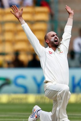 Australia's Nathan Lyon appeals successfully for the wicket of India's captain Virt Kohli during the first day of their second test cricket match in Bangalore, India, Saturday, March 4, 2017.