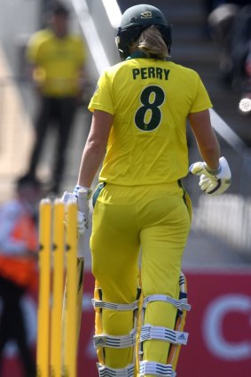 Ellyse Perry heads back to the pavilion after her dismissal at Manuka Oval on Sunday.