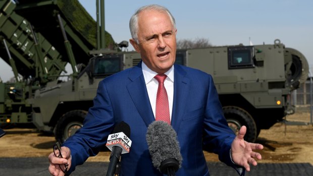 Prime Minister Malcolm Turnbull with a Bushmaster, one of Australia's export success stories.