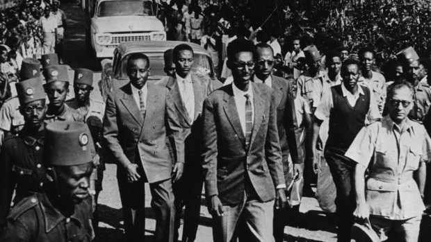 Rwanda Kigeli V Ndahindurwa (front) escorted through a town, c1959.