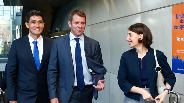 NSW Premier Mike Baird, Parramatta MP Geoff Lee and NSW Minister for Transport Gladys Berejiklian leave Parramatta Station after announcing new transport measures on Monday.
