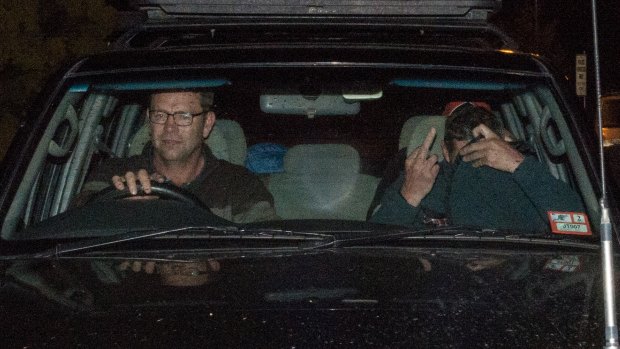 Mark Tromp leaves the Wangaratta Police Station (right) at night after being found.