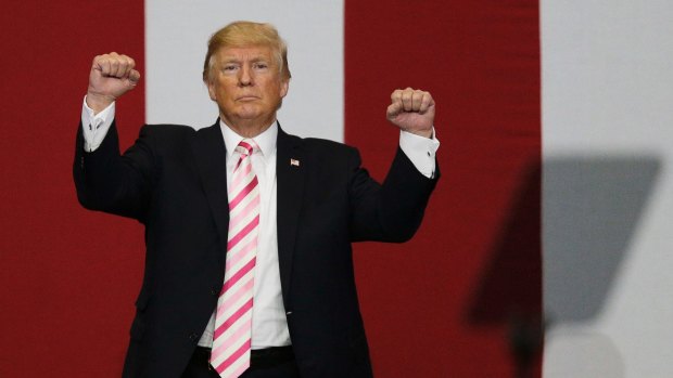 President Donald Trump walks off the stage after speaking at a campaign rally on Friday.