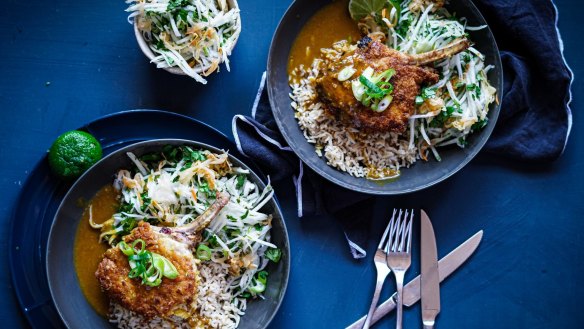 Crumbed pork cutlets with Japanese curry sauce, rice and kohlrabi, kimchi and coriander slaw.