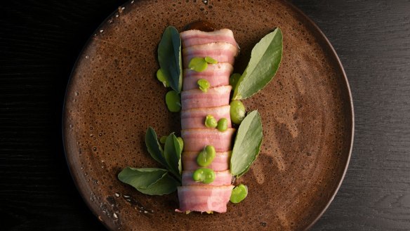 Barbecued leek wrapped in duck ham.