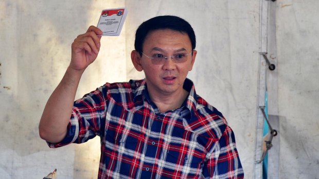 Jakarta Governor Ahok votes in the first round in February.
