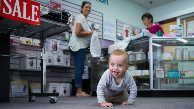 Closing: Baby Jack takes a final spin around Mothers Direct while his mum, Sasha, shops.