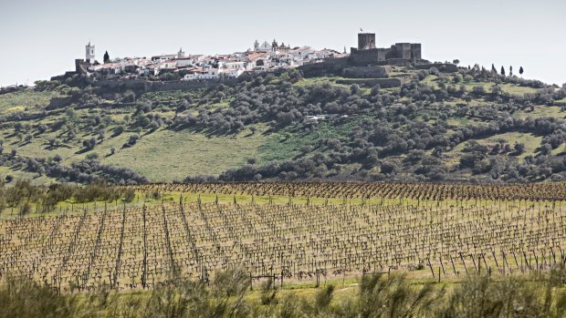 Views across Alentejo's vineyards to the fort town of Monsaraz.