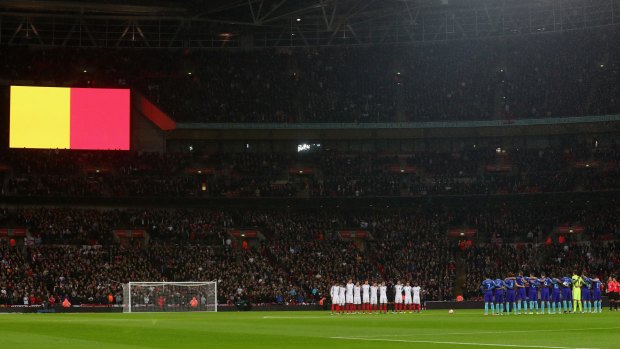England and Netherlands players observe a minute of silence for the victims of the Brussels terror attacks at Wembley Stadium on Tuesday.