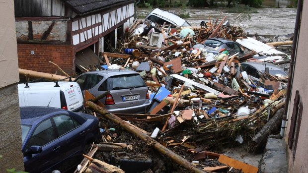 Cars were buried under an avalanche of debris in Braunsbach as severe storms swept Germany.