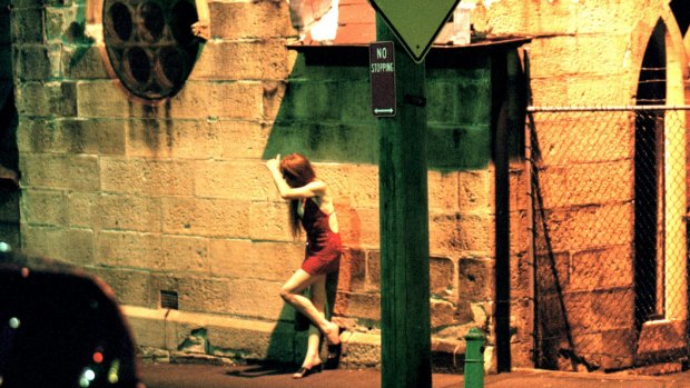 No choice: Modern slavery takes many forms, including sex trafficking. A prostitute stands on a street corner.