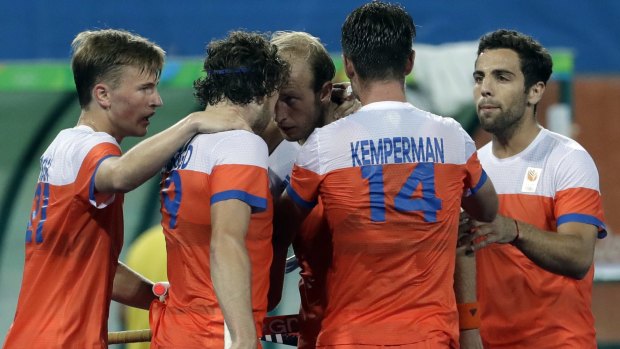The Netherlands' Seve Van Ass (second from left) celebrates after scoring against the Australians 