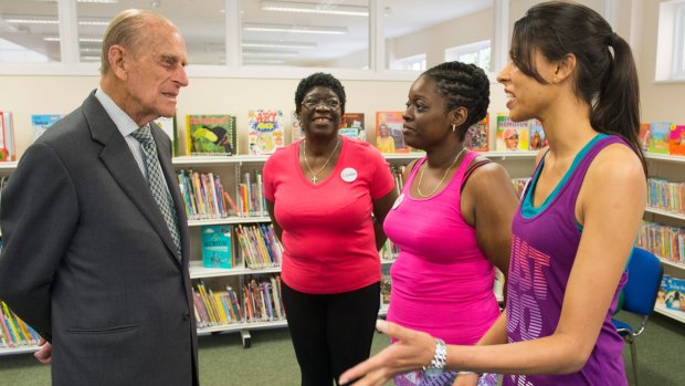 Prince Philip, Duke of Edinburgh, speaks to participants of a pilates class during a visit to Chadwell Heath Community Centre.