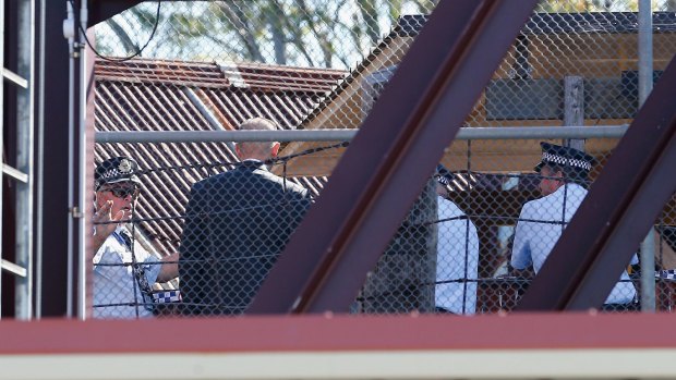 Police at the scene of the ride at Dreamworld in which four people died.