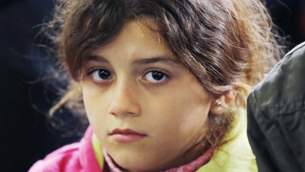 A young migrant waits after arriving in Munich, Germany.