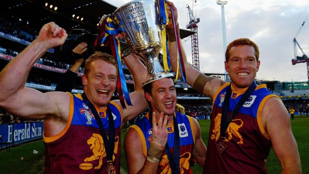Michael Voss, Craig McCrae and Justin Leppitsch after the Lions' mighty AFL grand final win against Collingwood in 2003.